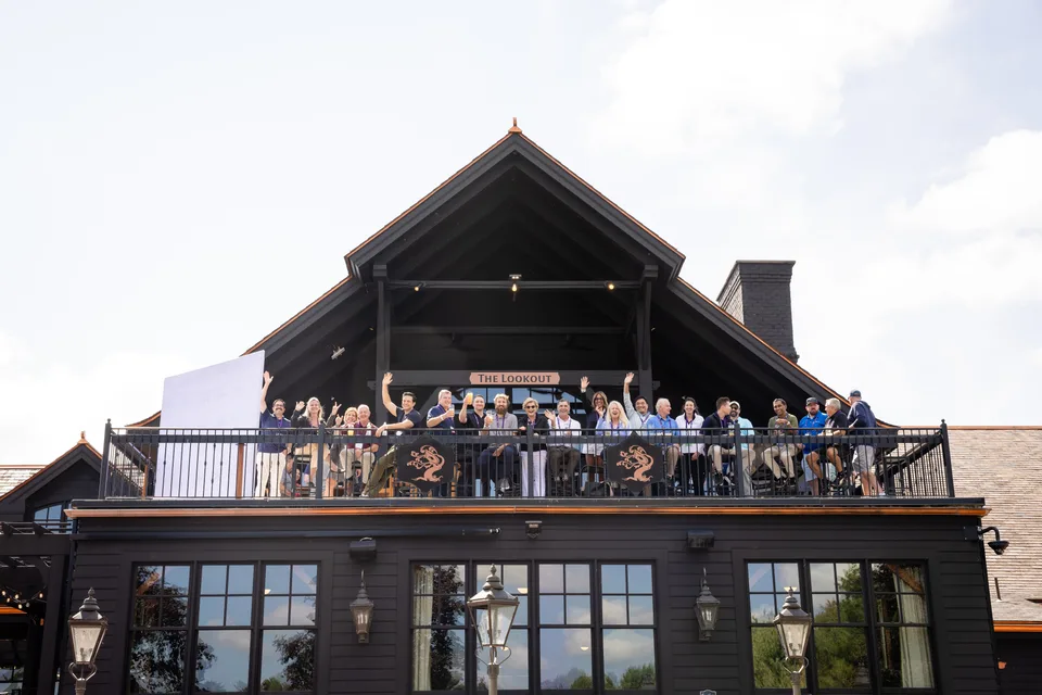 Tree House Brewing Company and Country Club building with event attendees on the Lookout balcony